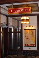 Gallon poster near lift